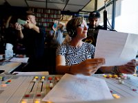 Surrounded by current and former DJ's, WUMD station manager, Jennifer Mulcare-Sullivan, is overcome with emotion as she signs off for the last time over the air as the station transitions to an online only broadcast.  The University of Massachusetts Dartmouth radio station, WUMD, stopped broadcasting over the airwaves after 42 continuous years.   It will now continue to broadcast strictly over the internet at www.umd.rocks   [ PETER PEREIRA/THE STANDARD-TIMES/SCMG ]